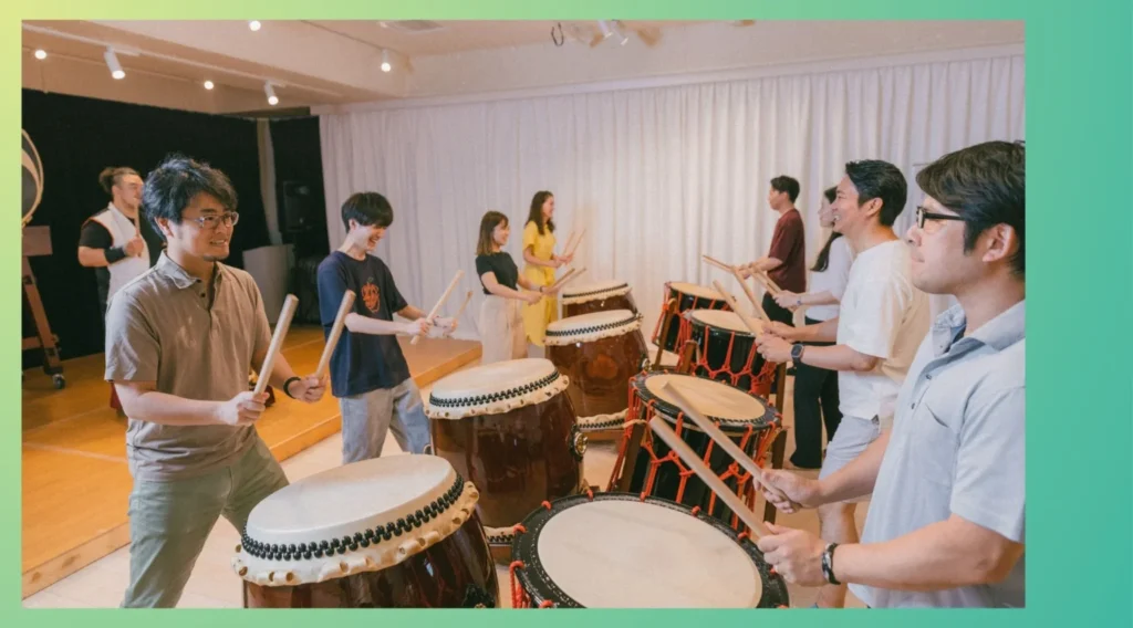 Corporate team building event in a music studio, where employees strengthen team unity through a taiko drum workshop activity